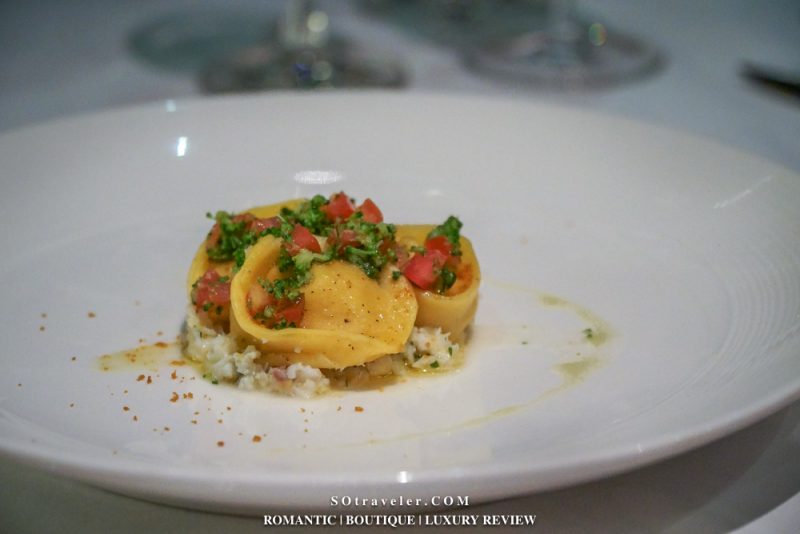 monkfish tortelli is served with a citrus sauce, Sardinian bottarga, fresh mint and broccoli salsa.