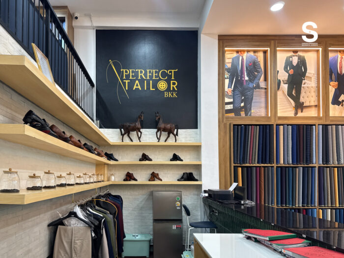 Expert tailor measuring a custom suit at Perfect Tailor BKK in Sukhumvit Bangkok